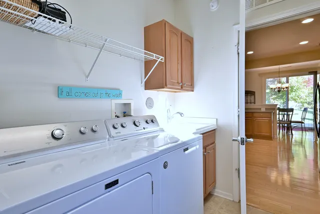a view of an house with backyard and trees