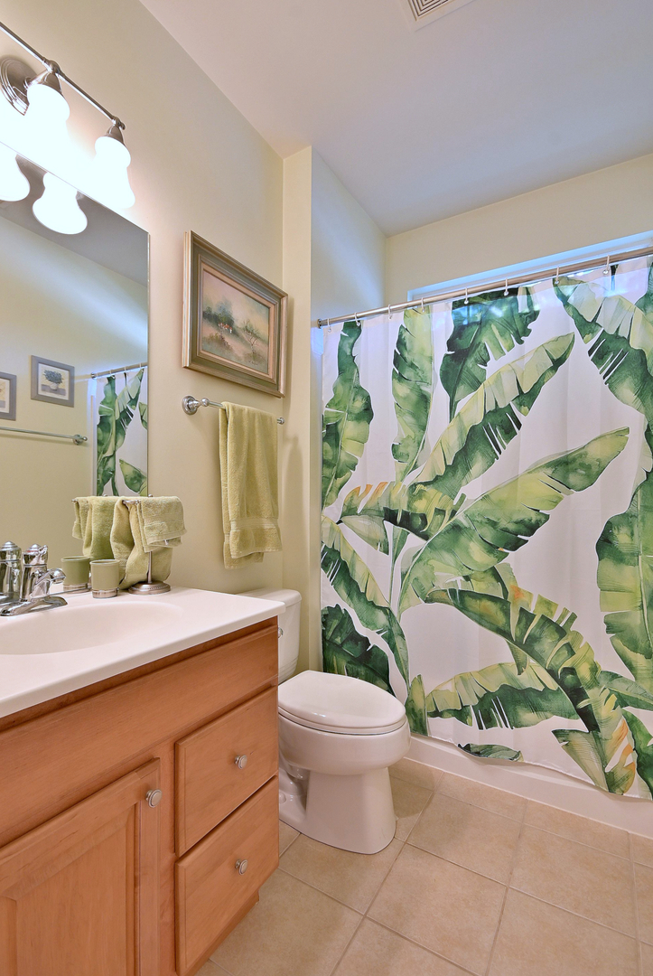 2832 Beacon Point Circle Elgin, IL 60124 - Photo 10 of 36 a bathroom with a granite countertop toilet sink and mirror