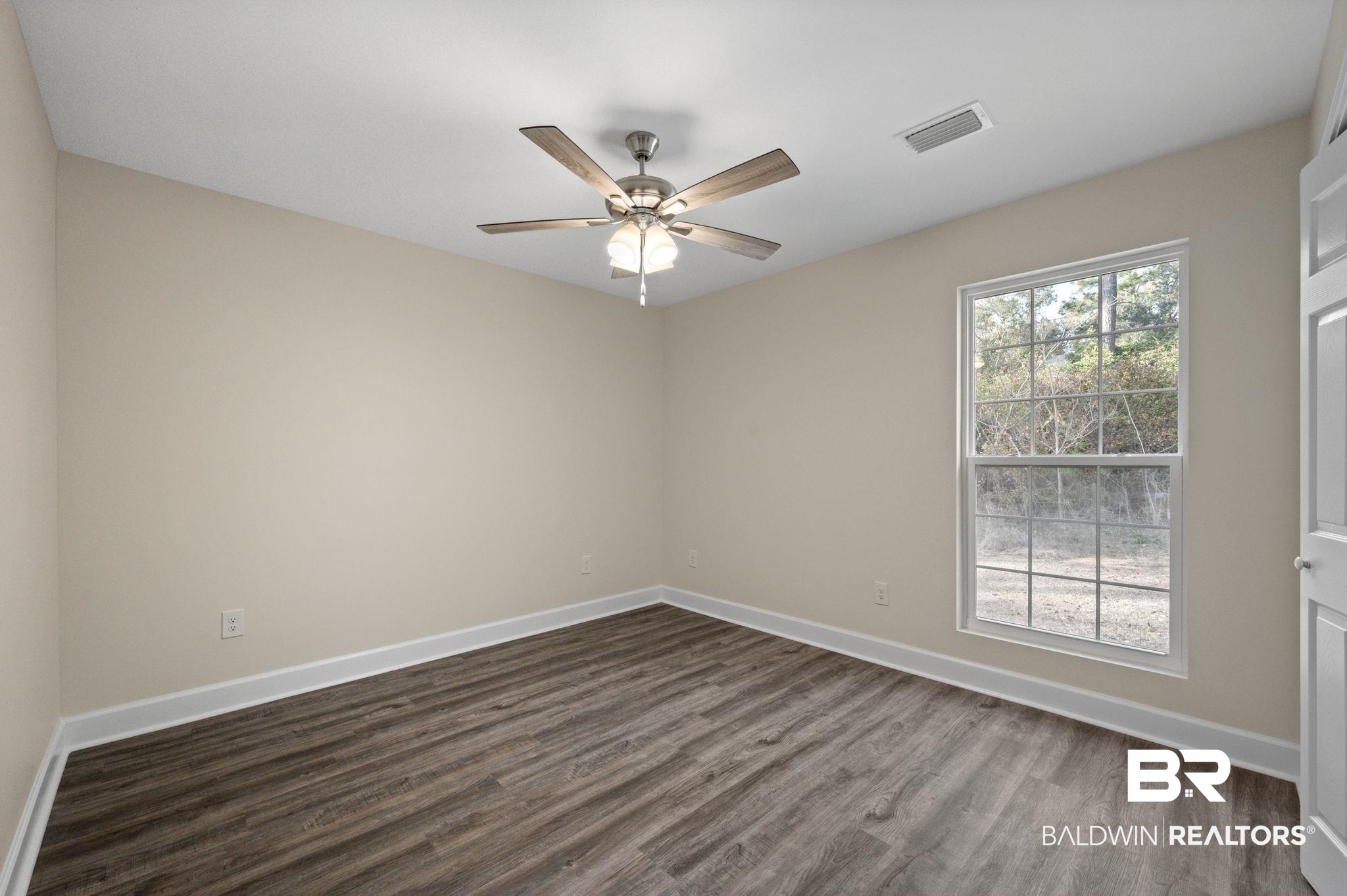 1473 Pollard Road Daphne, AL 36526 - Photo 26 of 32 Spare room featuring dark hardwood / wood-style flooring and ceiling fan