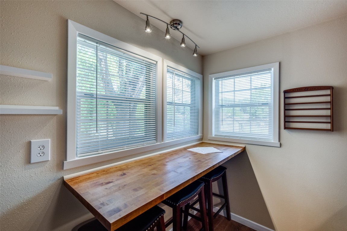 1200 West Phillips Street Alvin, TX 77511 - Photo 11 of 31 a dining room with a table and chairs