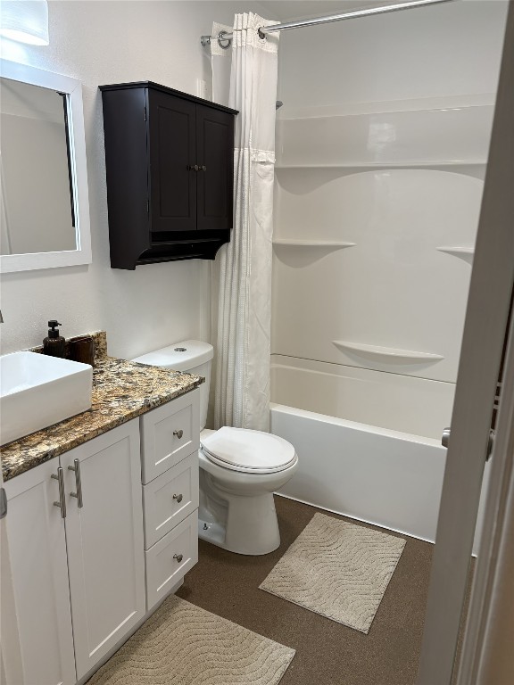 1200 West Phillips Street Alvin, TX 77511 - Photo 17 of 31 a bathroom with a granite countertop toilet sink and mirror