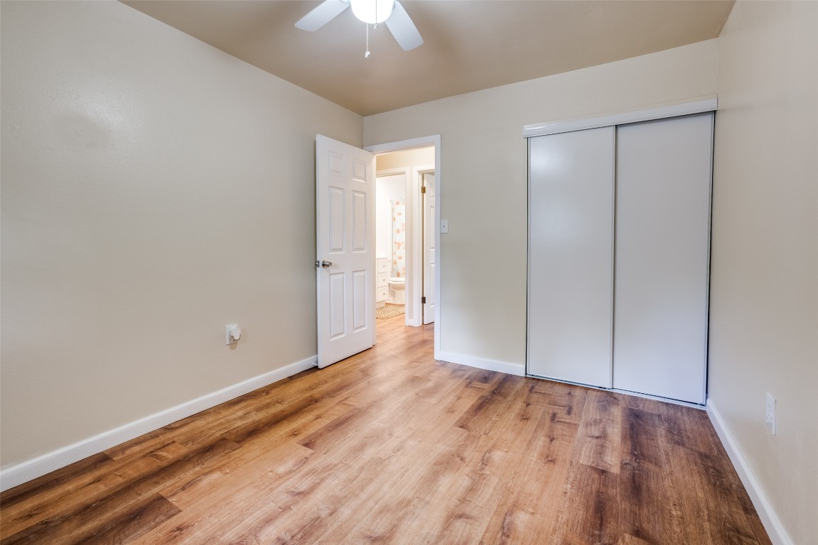 1200 West Phillips Street Alvin, TX 77511 - Photo 18 of 31 wooden floor in an empty room