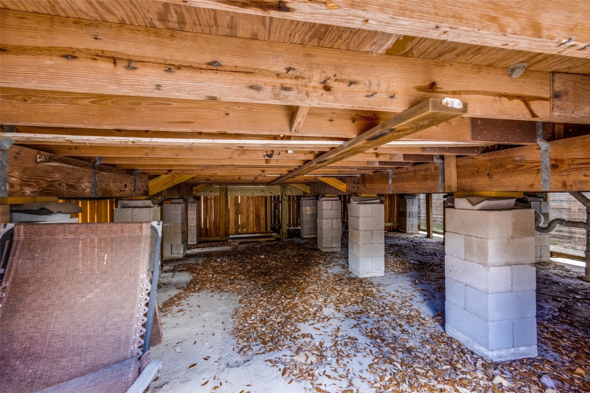 1200 West Phillips Street Alvin, TX 77511 - Photo 23 of 31 a view of a storage room with wooden floor