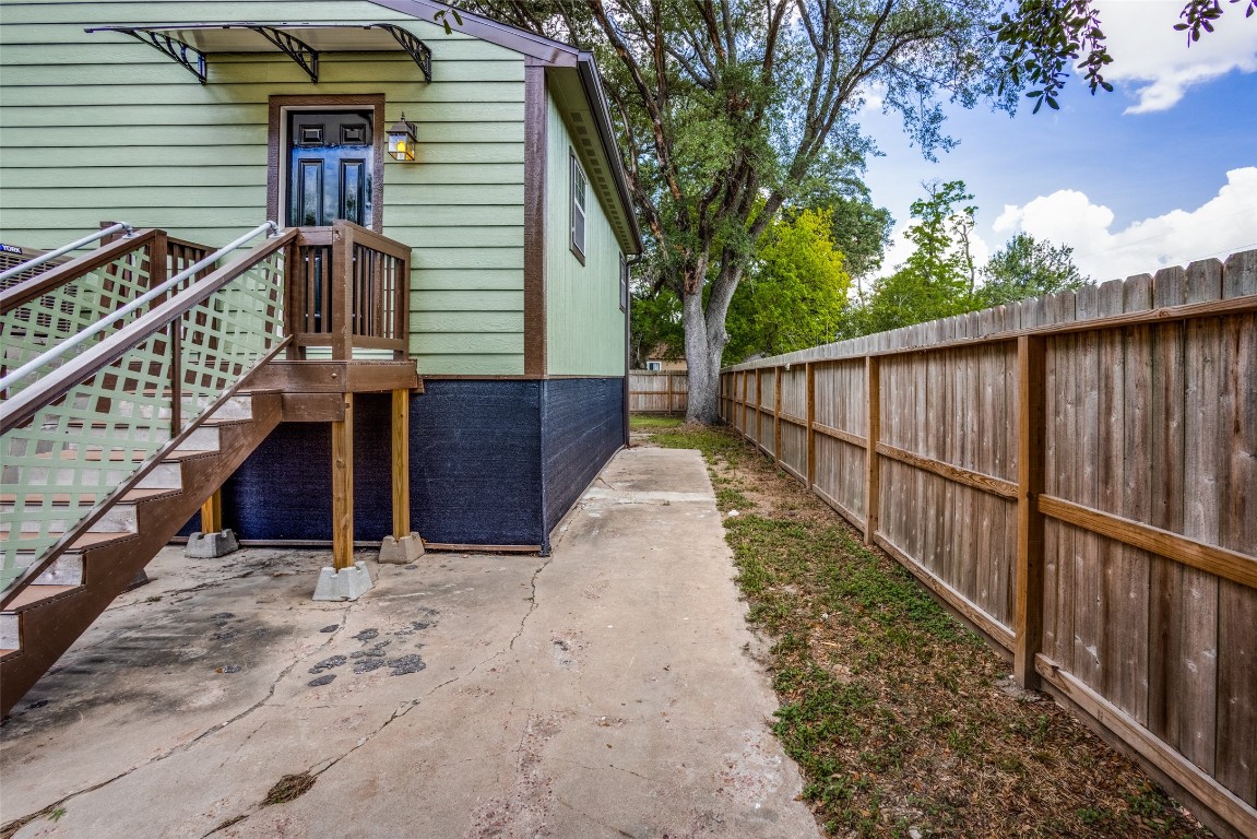 1200 West Phillips Street Alvin, TX 77511 - Photo 25 of 31 a view of a house with wooden fence