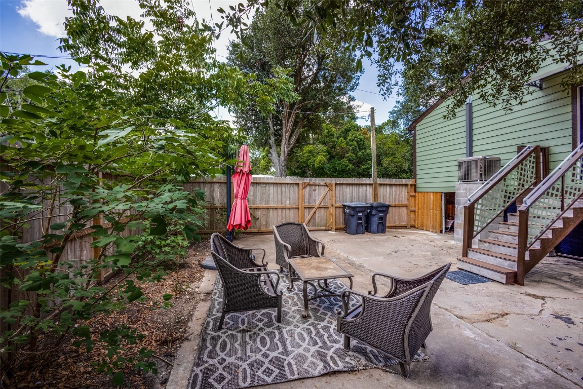 1200 West Phillips Street Alvin, TX 77511 - Photo 27 of 31 a view of backyard with seating space and trees