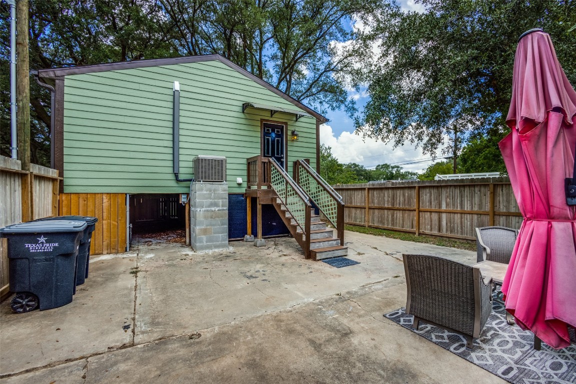 1200 West Phillips Street Alvin, TX 77511 - Photo 28 of 31 a view of a house with a backyard