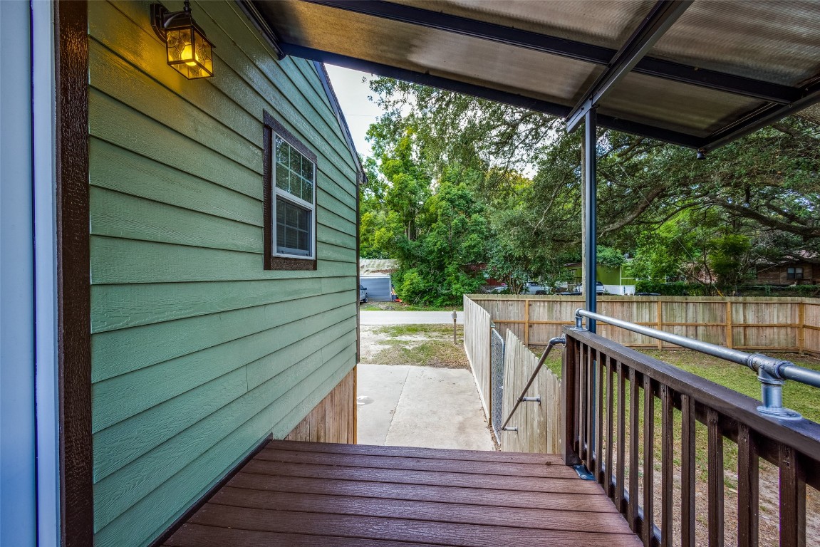 1200 West Phillips Street Alvin, TX 77511 - Photo 3 of 31 a view of deck with wooden floor and outdoor seating