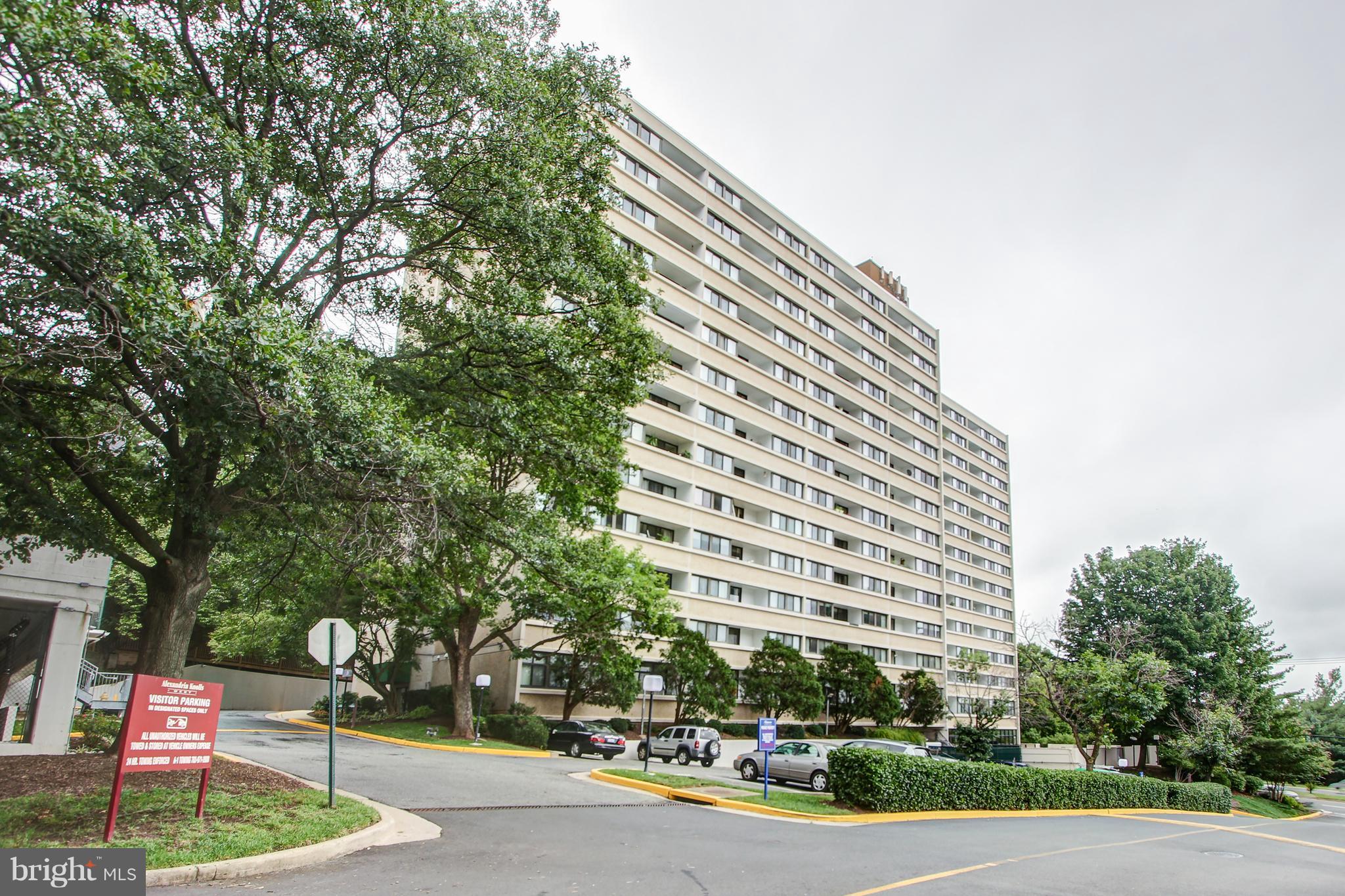 5911 Edsall Road, Unit 902 Alexandria, VA 22304 - Photo 1 of 26 a front view of a building with tree s