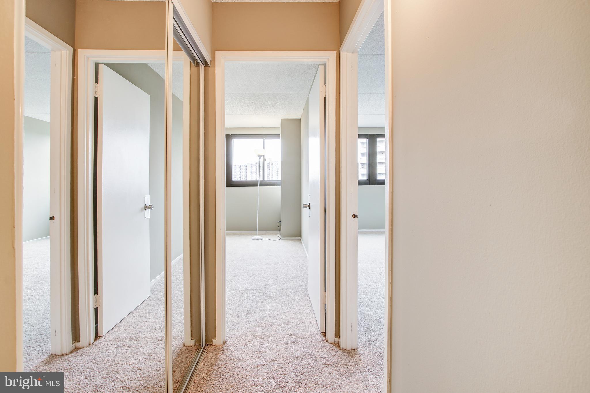 5911 Edsall Road, Unit 902 Alexandria, VA 22304 - Photo 16 of 26 a view of a bathroom from a hallway