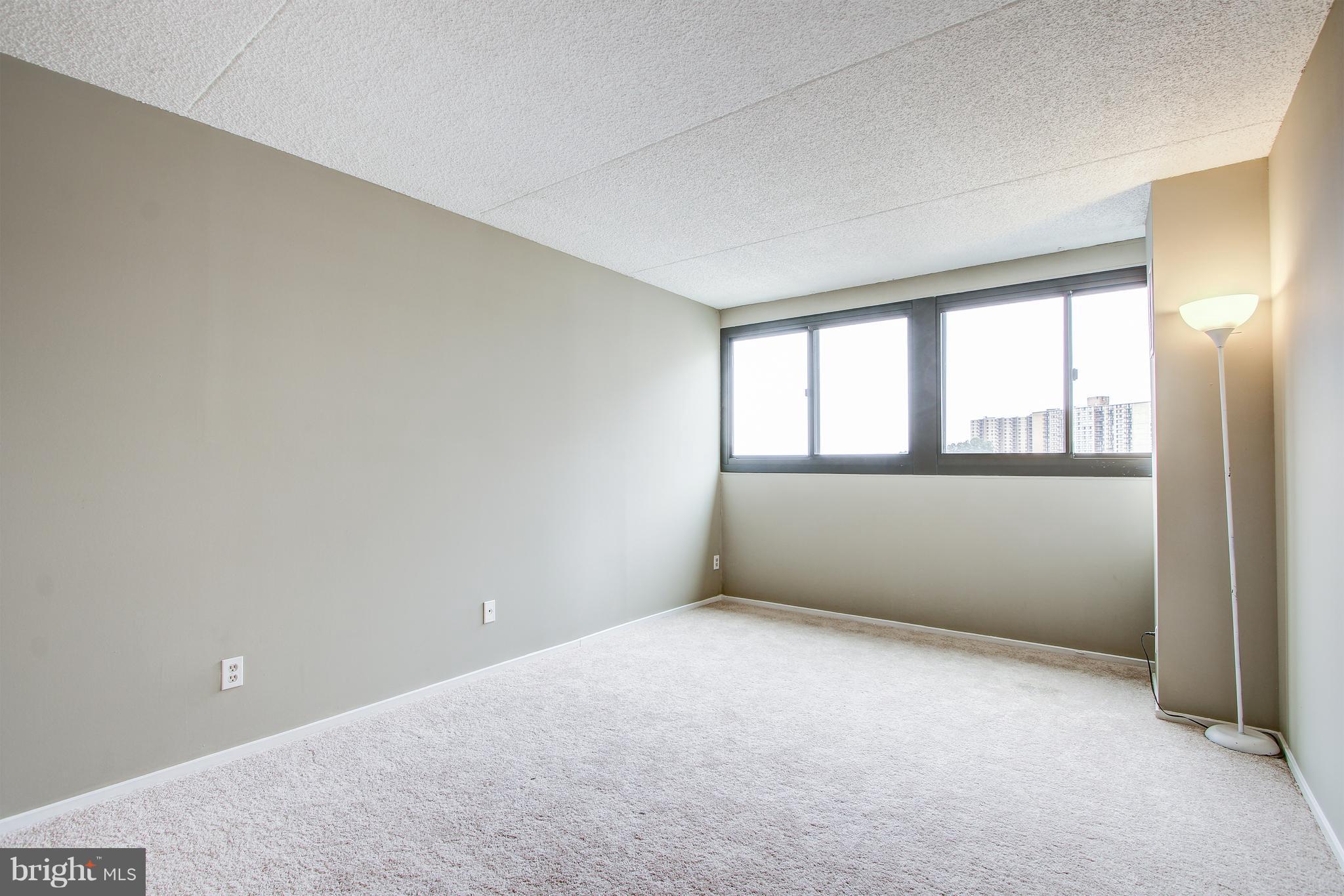 5911 Edsall Road, Unit 902 Alexandria, VA 22304 - Photo 17 of 26 an empty room with windows