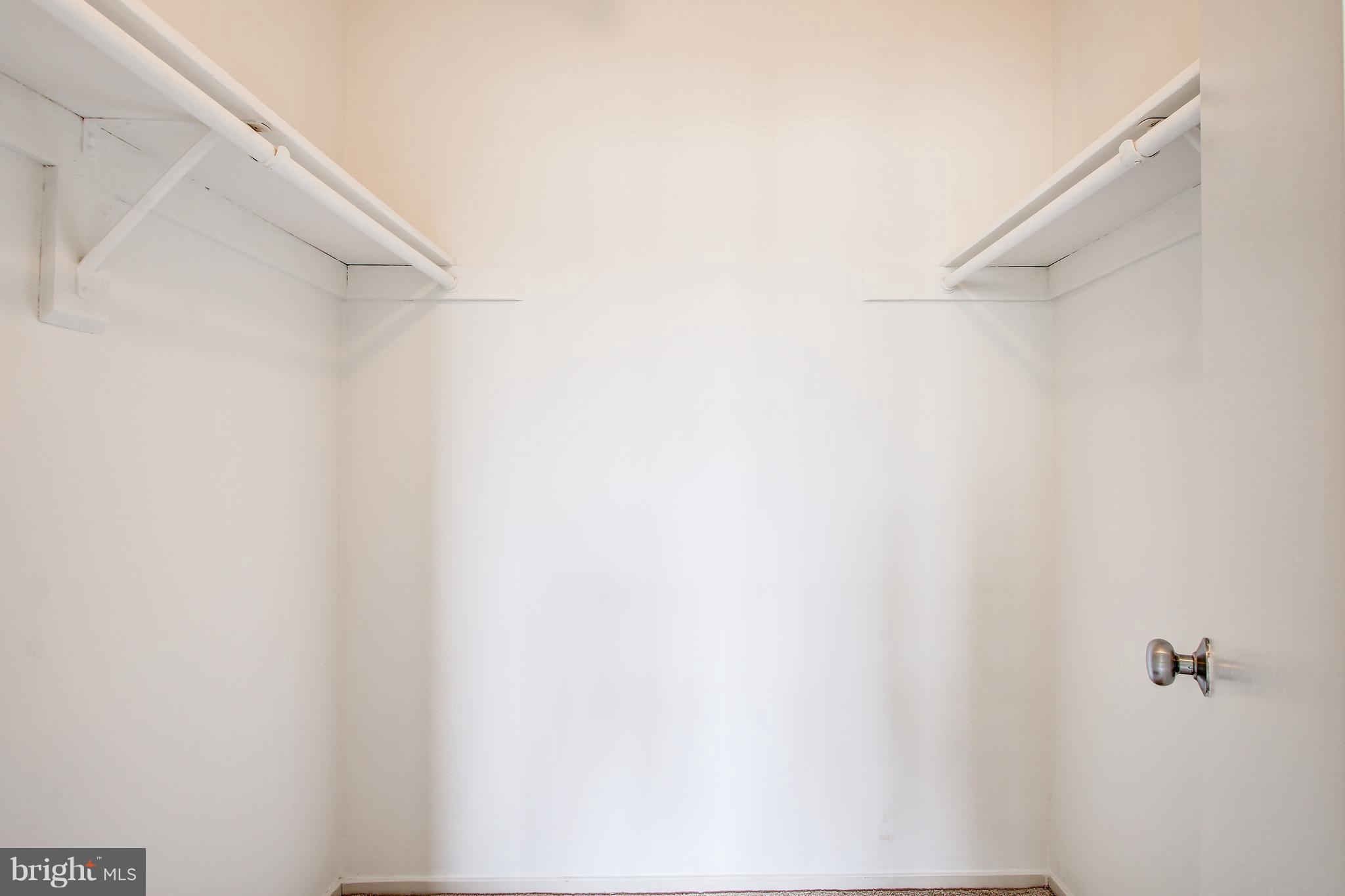 5911 Edsall Road, Unit 902 Alexandria, VA 22304 - Photo 19 of 26 a view of staircase with white walls