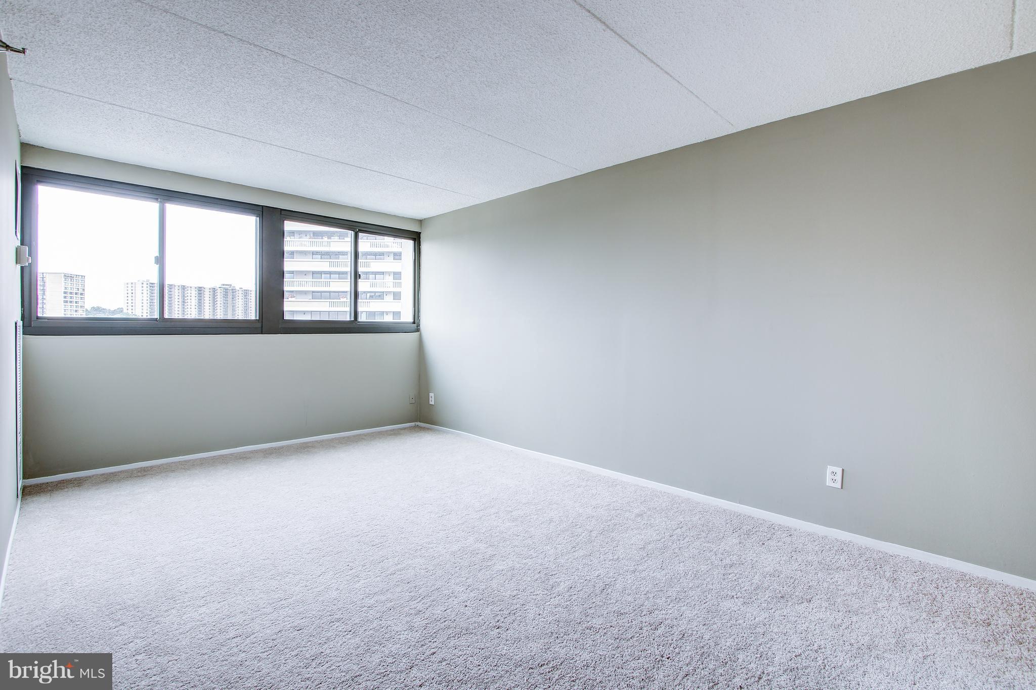 5911 Edsall Road, Unit 902 Alexandria, VA 22304 - Photo 20 of 26 an empty room with a window