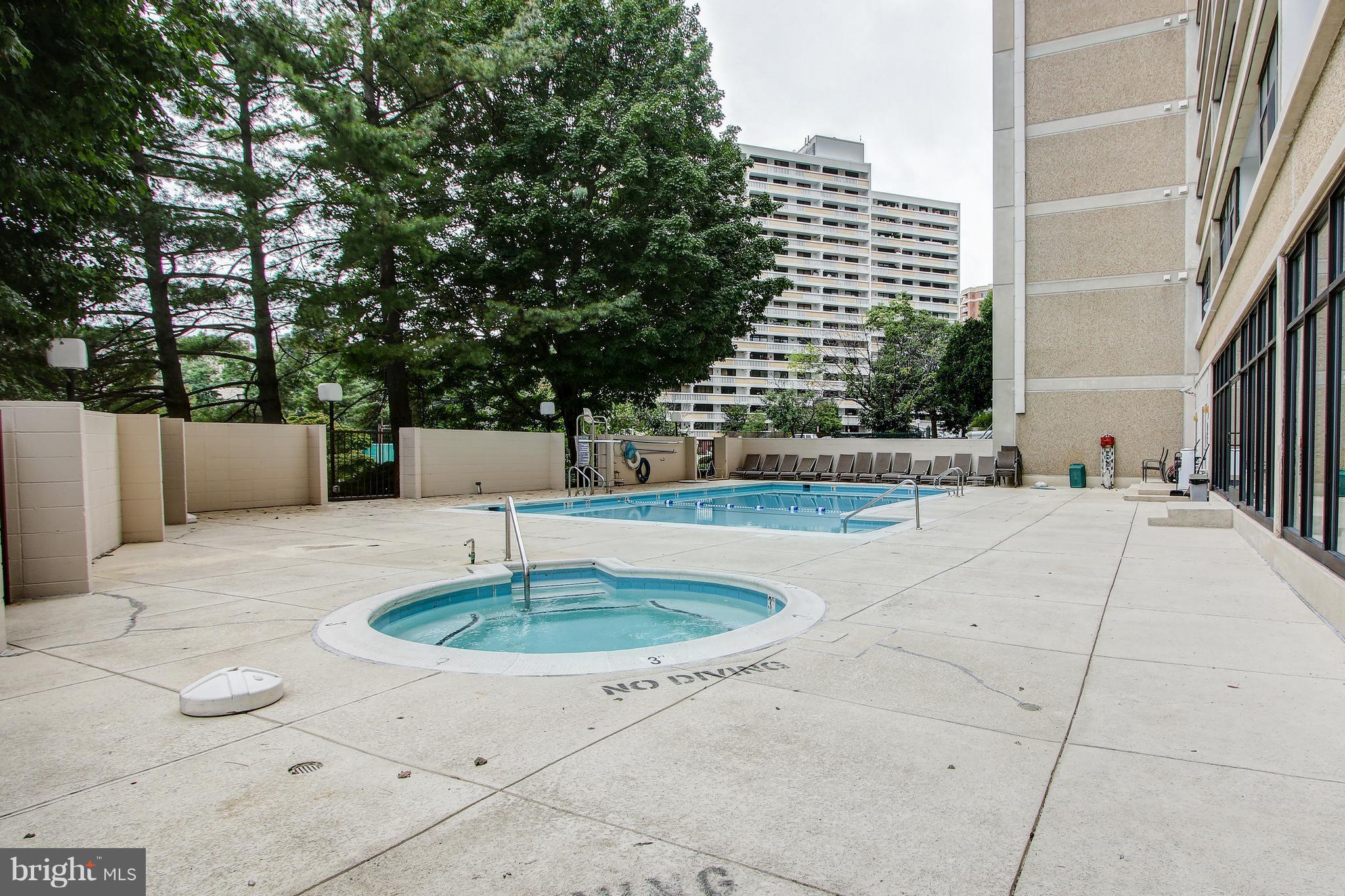 5911 Edsall Road, Unit 902 Alexandria, VA 22304 - Photo 23 of 26 a swimming pool with tall buildings