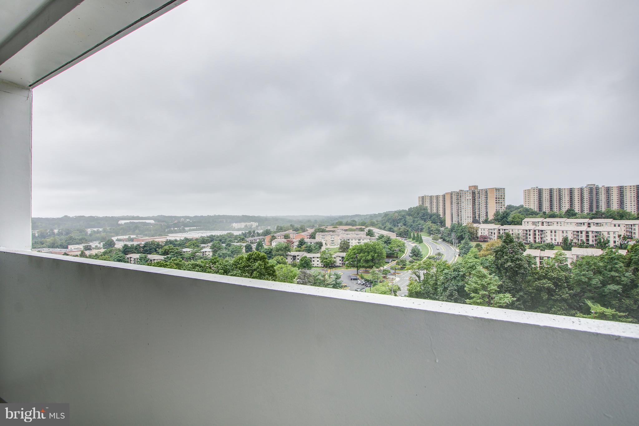 5911 Edsall Road, Unit 902 Alexandria, VA 22304 - Photo 8 of 26 a view of a city skyline from a terrace
