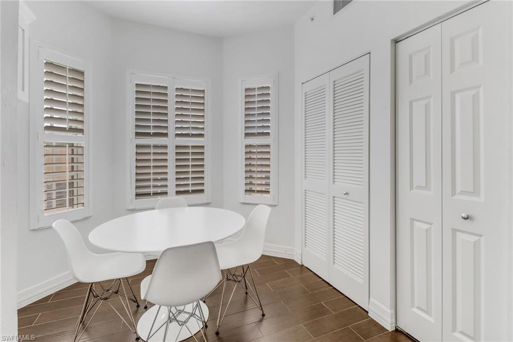 450 Bayfront Place, Unit 4201 Naples, FL 34102 - Photo 5 of 23 a view of a dining room with furniture and wooden floor