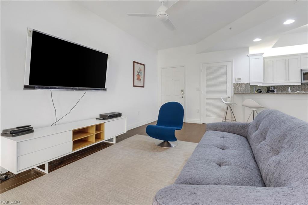 450 Bayfront Place, Unit 4201 Naples, FL 34102 - Photo 8 of 23 a living room with furniture and a flat screen tv