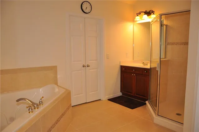 a bathroom with a bathtub and shower