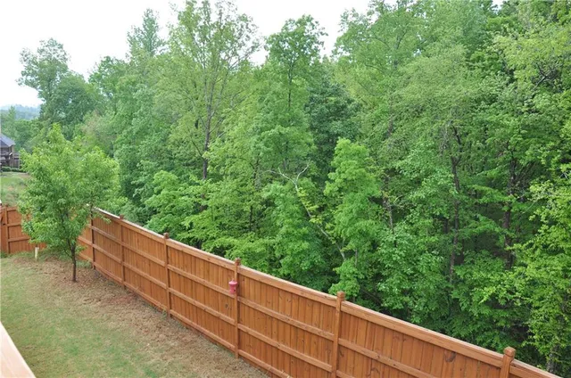 a view of a bench in a forest
