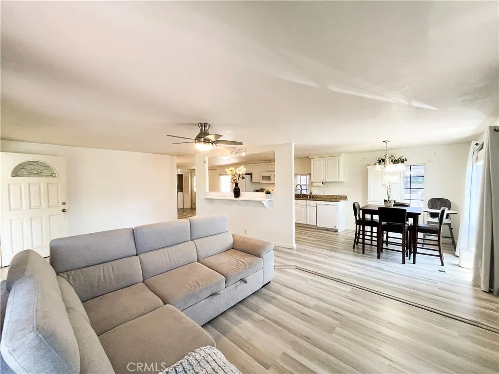 17700 Avalon, Unit 40 Carson, CA 90746 - Photo 15 of 32 a living room with furniture wooden floor and kitchen view