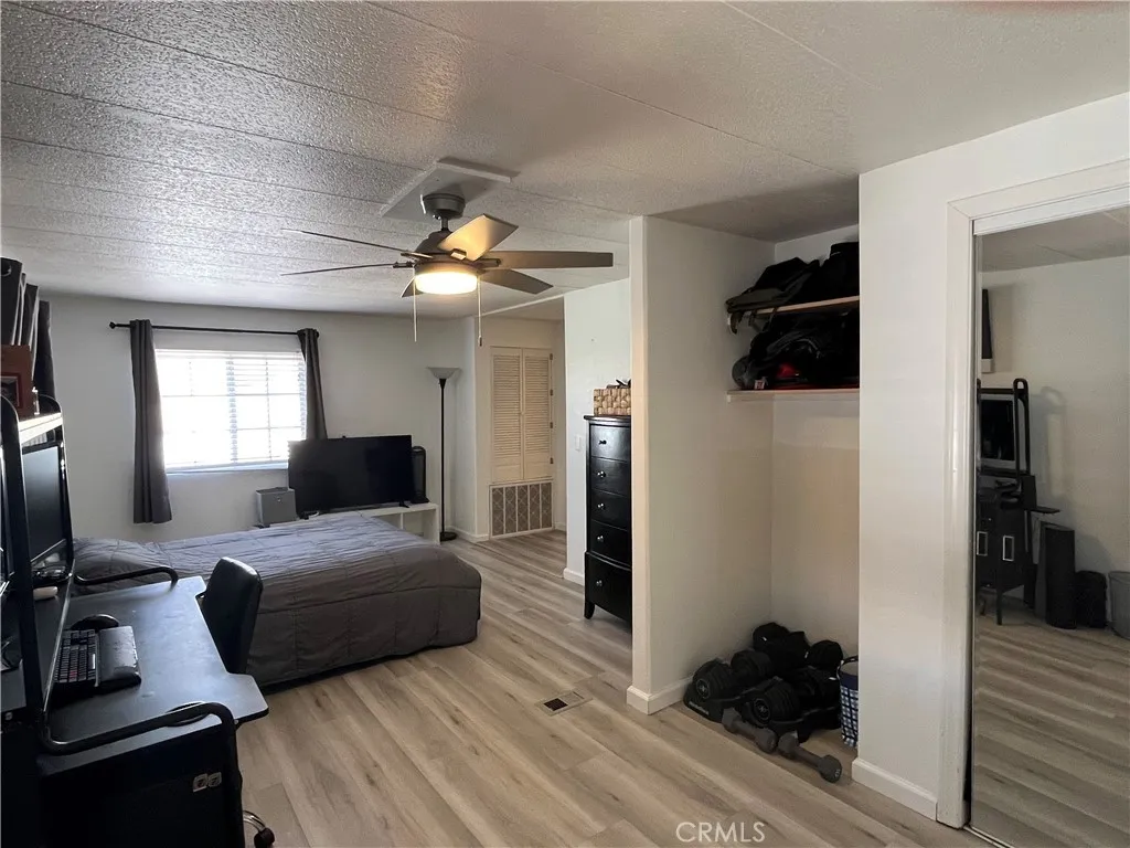 17700 Avalon, Unit 40 Carson, CA 90746 - Photo 19 of 32 a bedroom with a bed and a large window