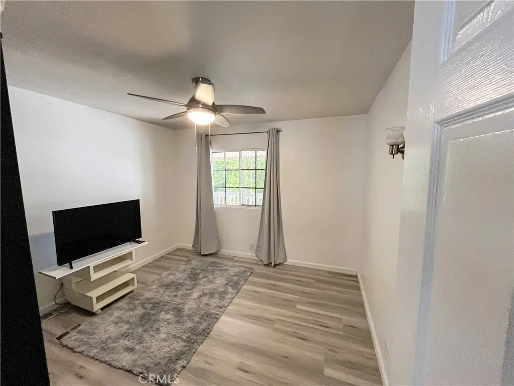 17700 Avalon, Unit 40 Carson, CA 90746 - Photo 23 of 32 a bedroom with a bed and a flat screen tv