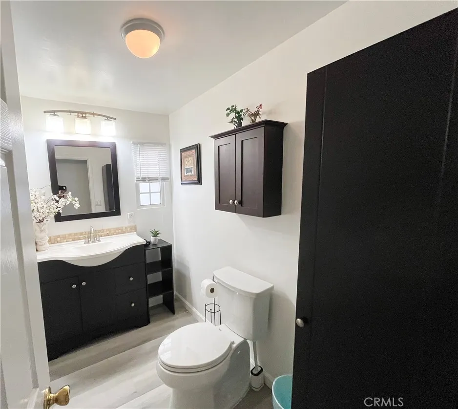 17700 Avalon, Unit 40 Carson, CA 90746 - Photo 26 of 32 a bathroom with a toilet sink vanity granite and mirror