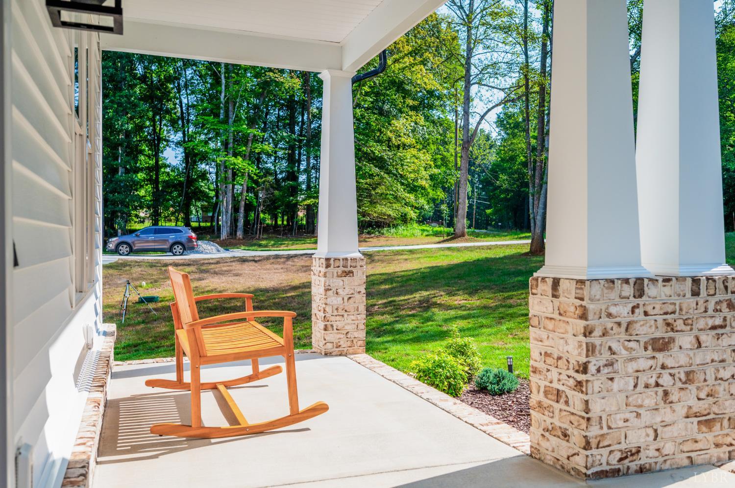 2262 Hooper Road Forest, VA 24551 - Photo 20 of 80 a view of a chair and tables in the garden