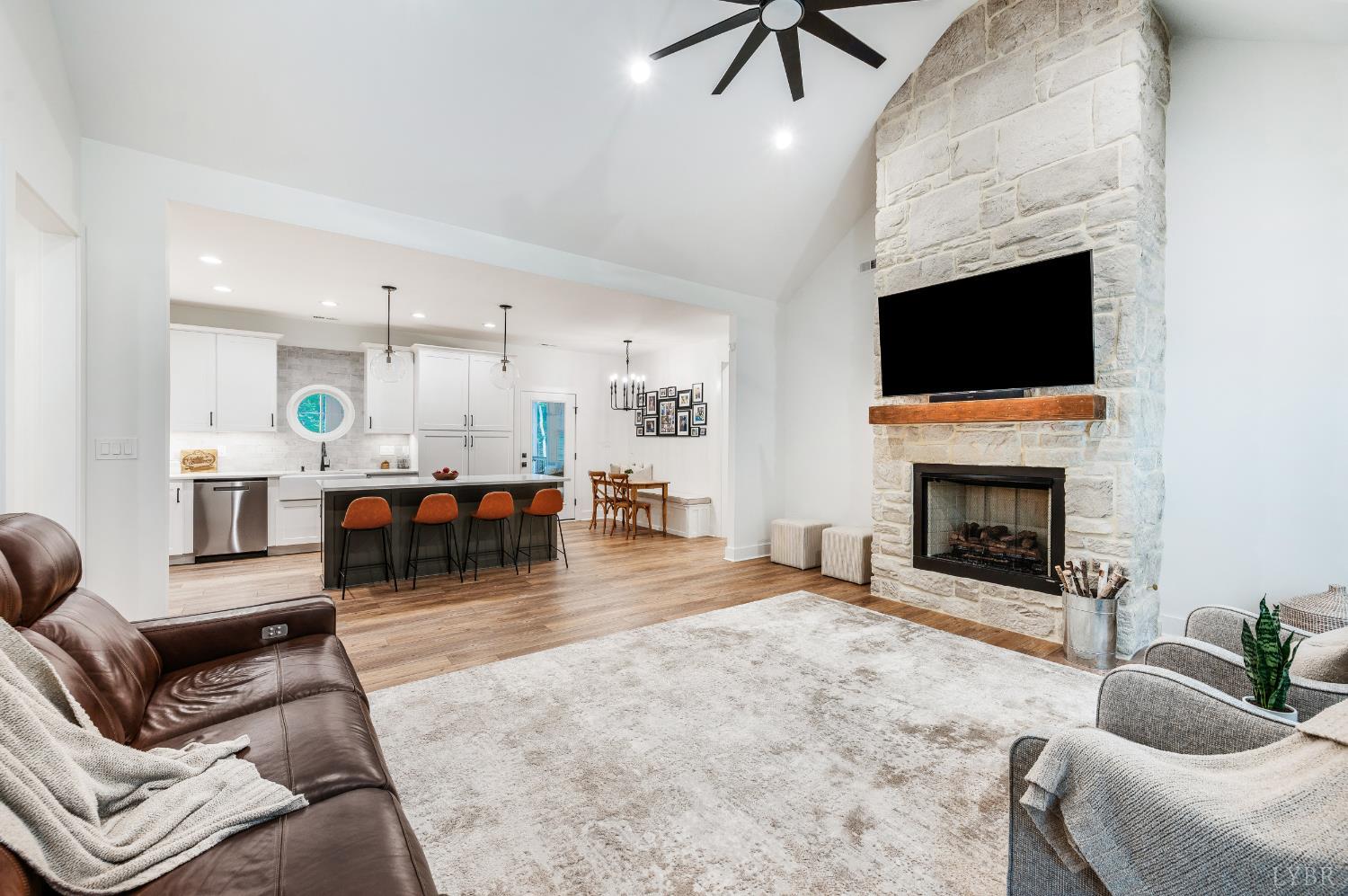 2262 Hooper Road Forest, VA 24551 - Photo 21 of 80 a living room with furniture and a fireplace