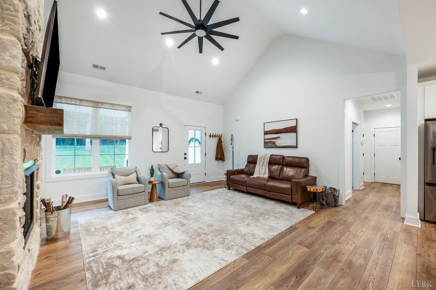 2262 Hooper Road Forest, VA 24551 - Photo 23 of 80 a living room with furniture and a flat screen tv