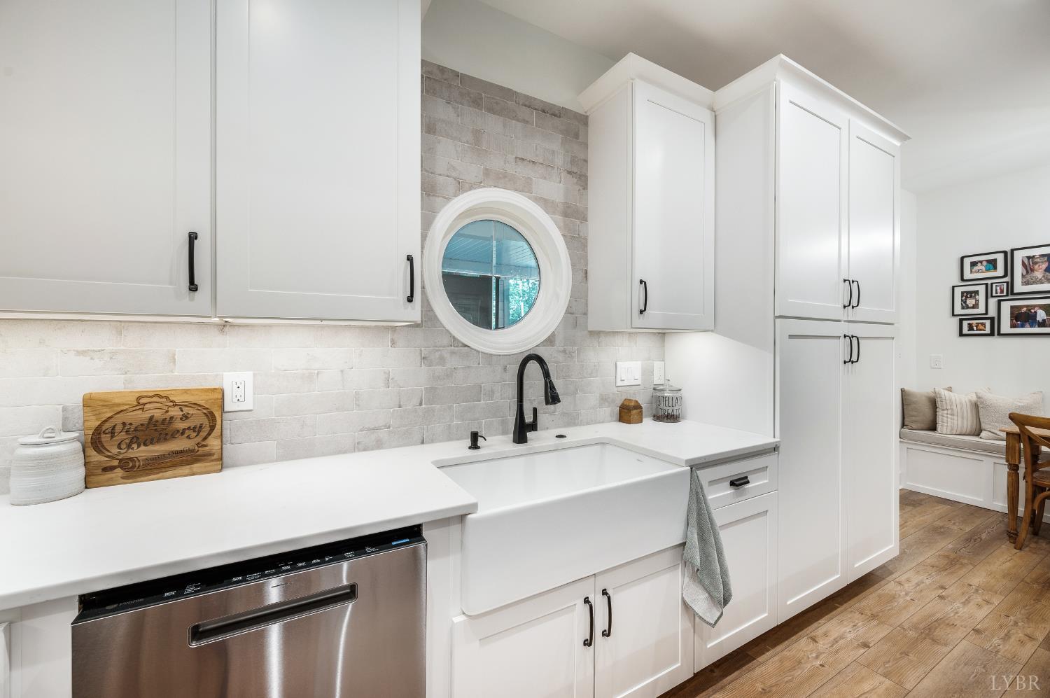 2262 Hooper Road Forest, VA 24551 - Photo 34 of 80 a kitchen with stainless steel appliances a sink a stove and a wooden floors