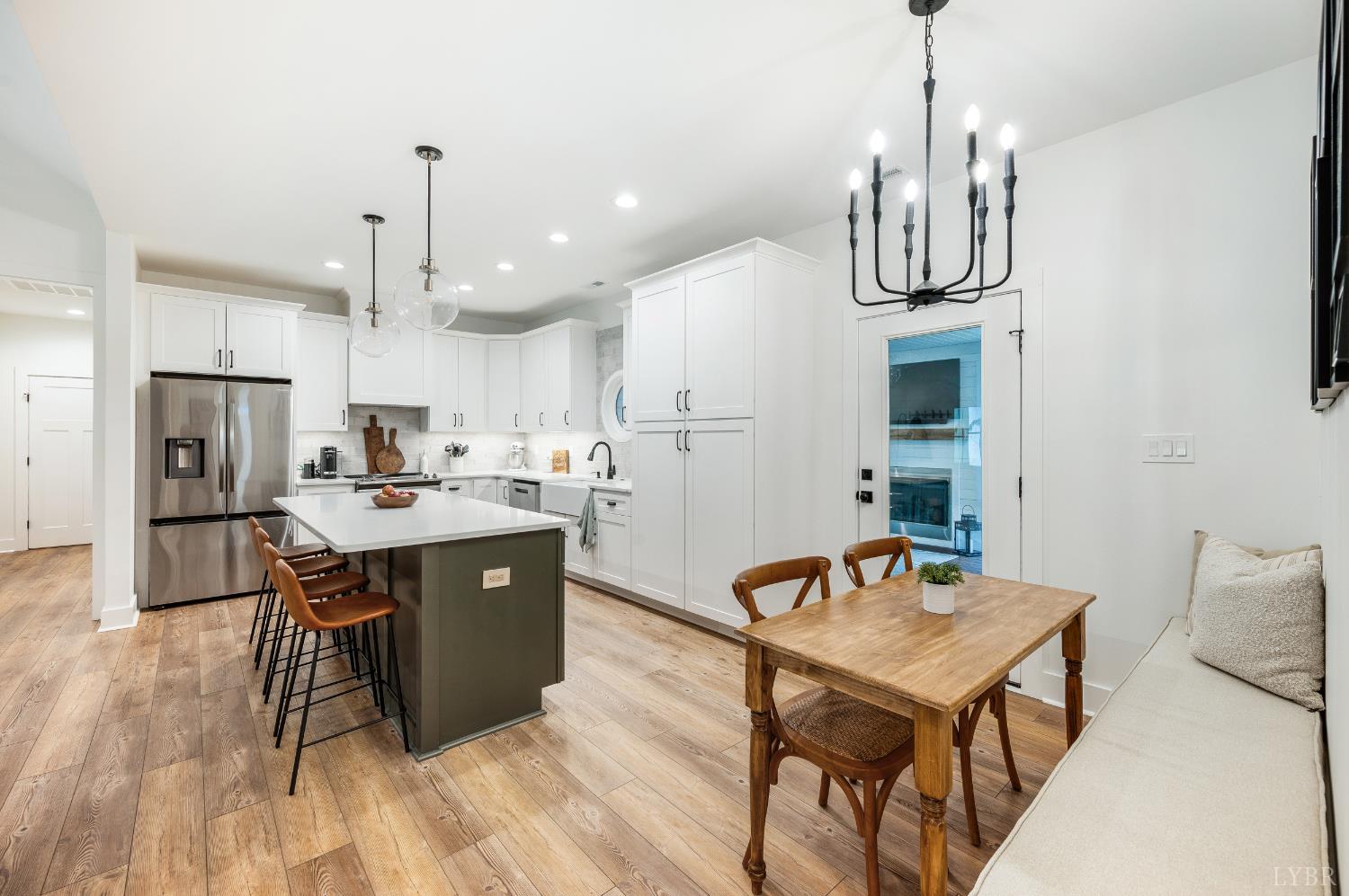 2262 Hooper Road Forest, VA 24551 - Photo 36 of 80 a kitchen with stainless steel appliances granite countertop a kitchen island a stove a table and chairs in it