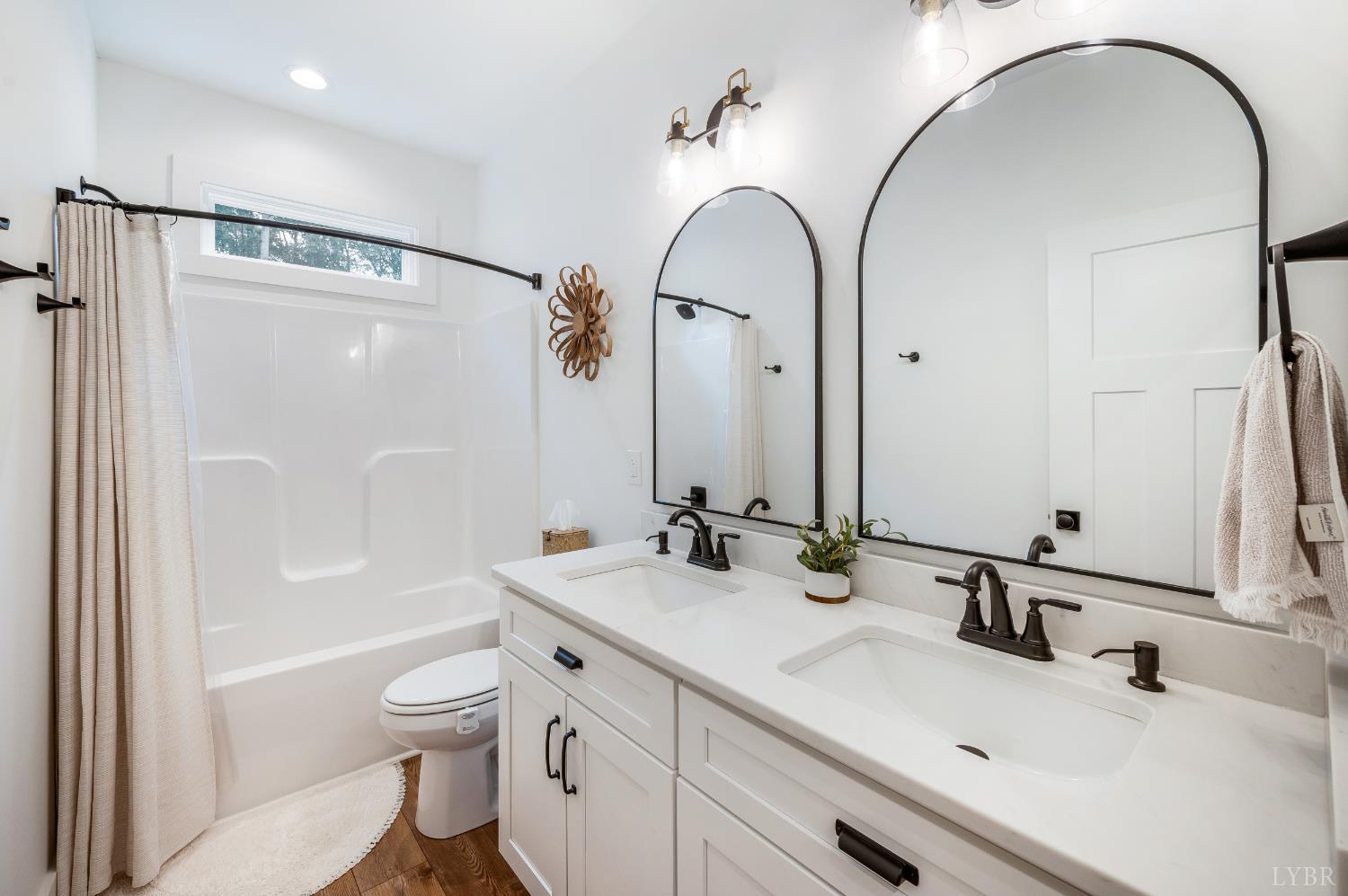 2262 Hooper Road Forest, VA 24551 - Photo 40 of 80 a bathroom with a double vanity sink mirror and toilet