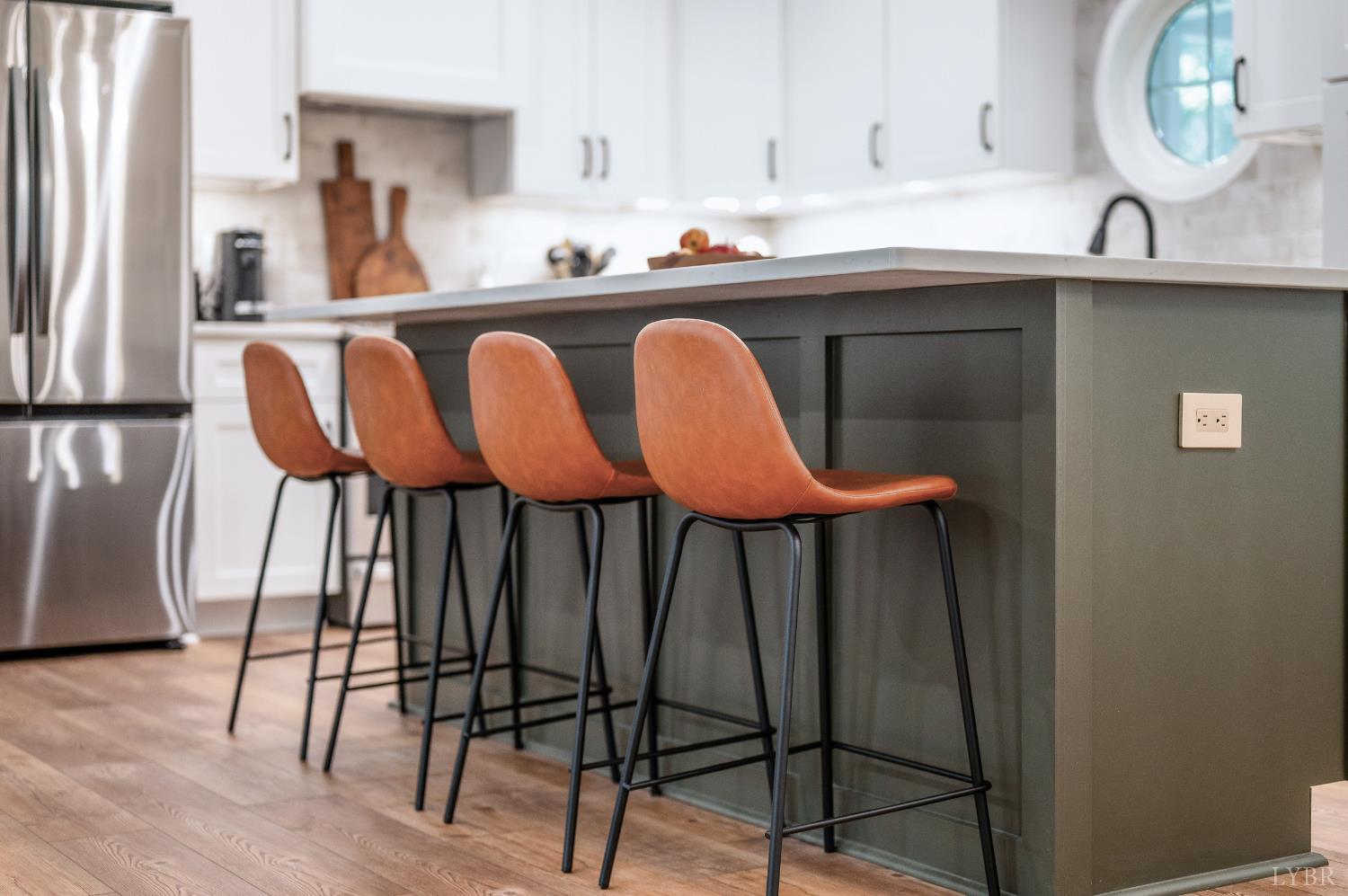 2262 Hooper Road Forest, VA 24551 - Photo 5 of 80 a kitchen with a table chairs and a refrigerator