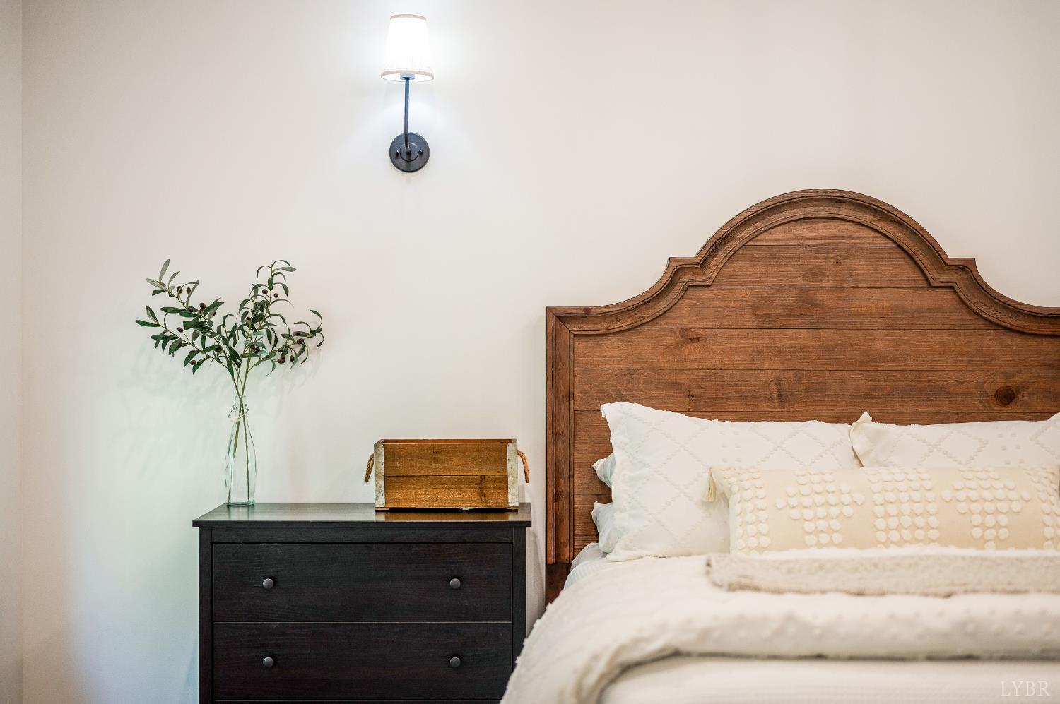 2262 Hooper Road Forest, VA 24551 - Photo 55 of 80 a bedroom with a bed and a potted plant