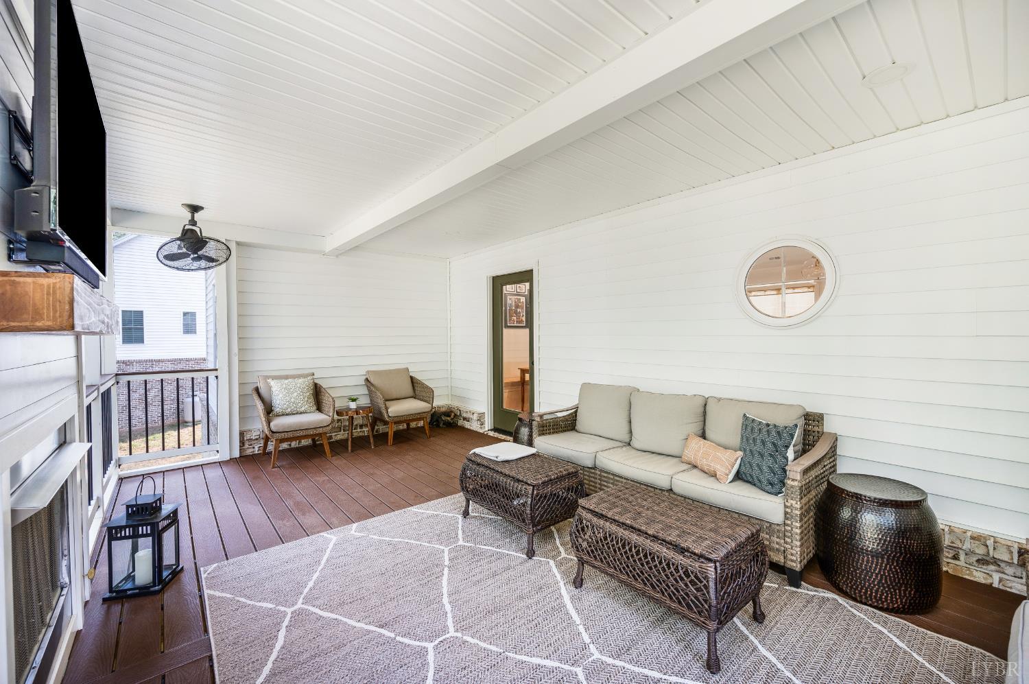 2262 Hooper Road Forest, VA 24551 - Photo 66 of 80 a living room with furniture and a flat screen tv