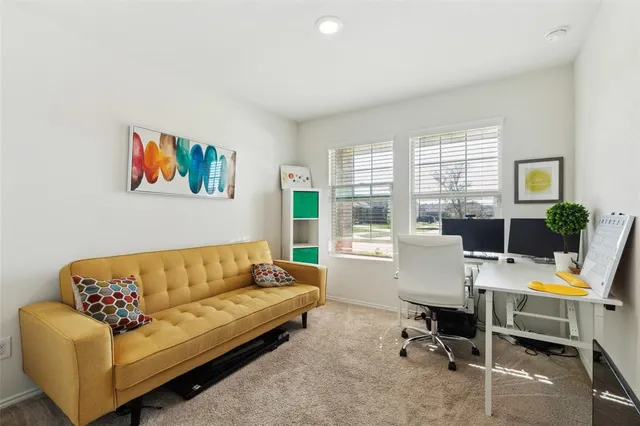 a living room with furniture rug and window
