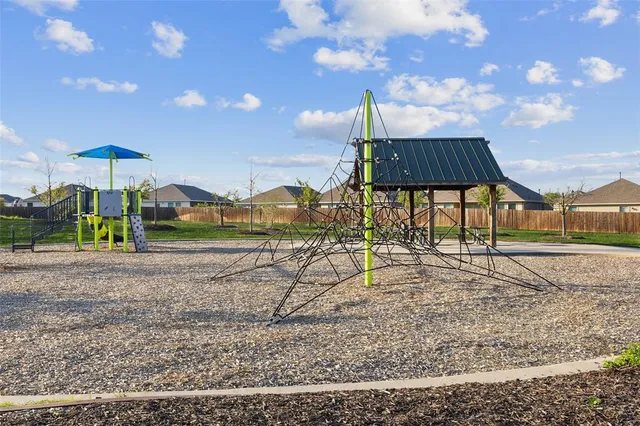 a view of a yard with a slide