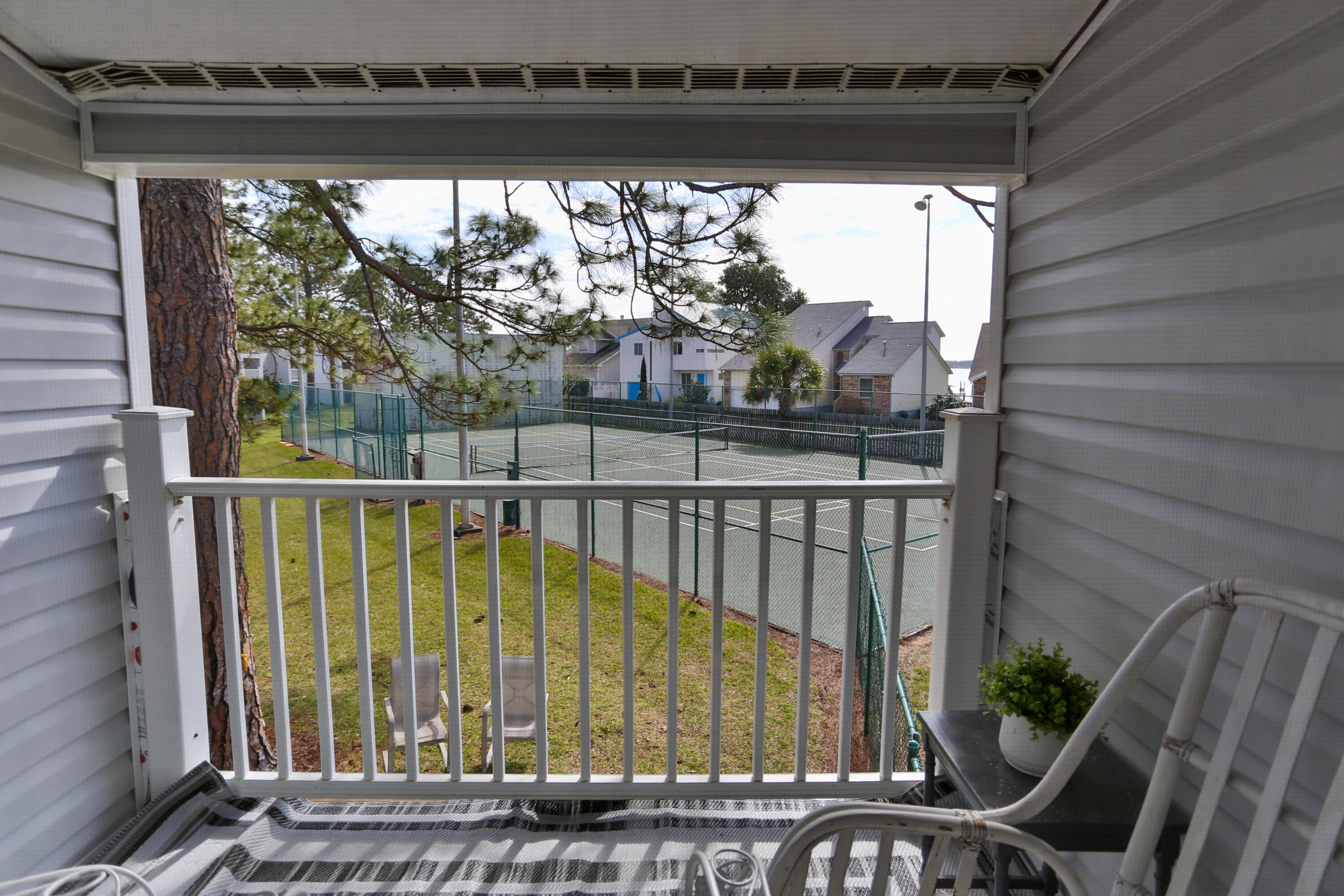 101 Old Ferry Road, Unit 1D Shalimar, FL 32579 - Photo 12 of 34 a view of a balcony with an outdoor space