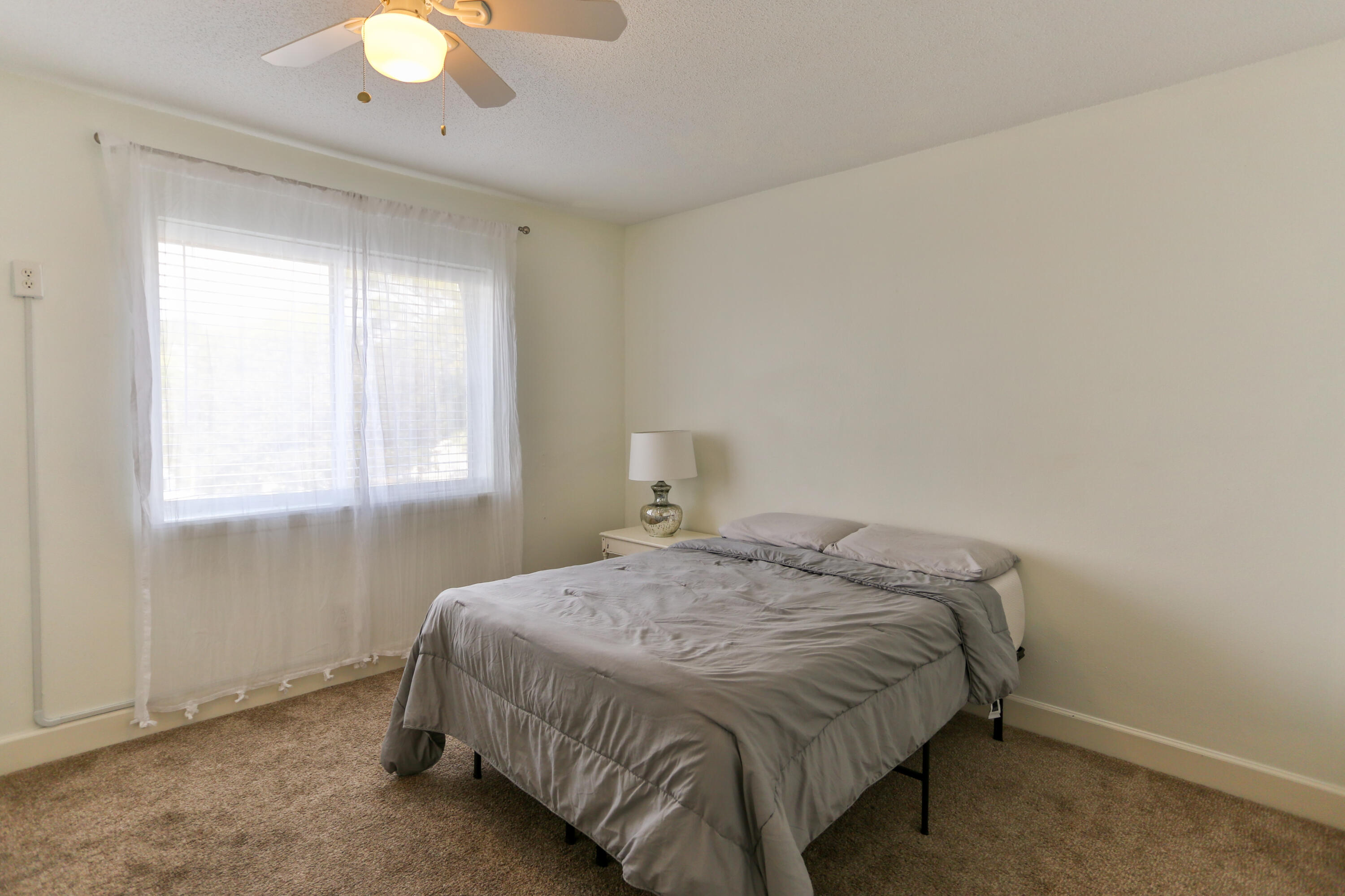 101 Old Ferry Road, Unit 1D Shalimar, FL 32579 - Photo 18 of 34 a bedroom with a bed and window