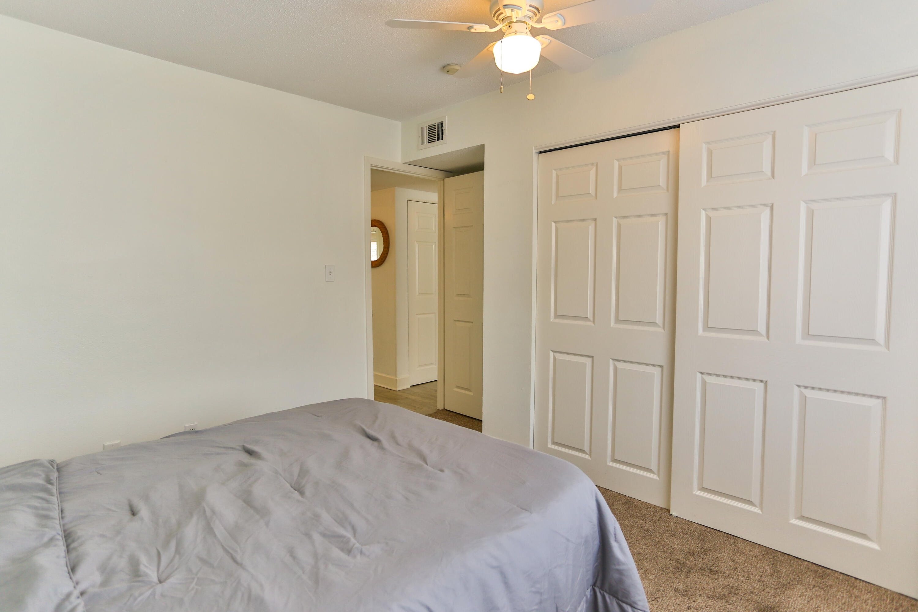 101 Old Ferry Road, Unit 1D Shalimar, FL 32579 - Photo 19 of 34 a view of a livingroom with wooden floor and closet area