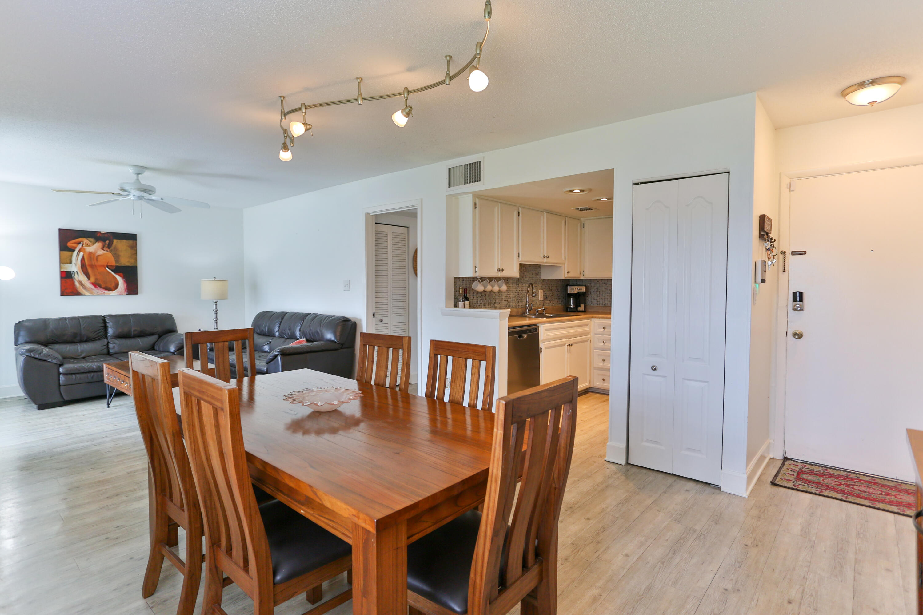 101 Old Ferry Road, Unit 1D Shalimar, FL 32579 - Photo 2 of 34 a view of a dining room with furniture and wooden floor