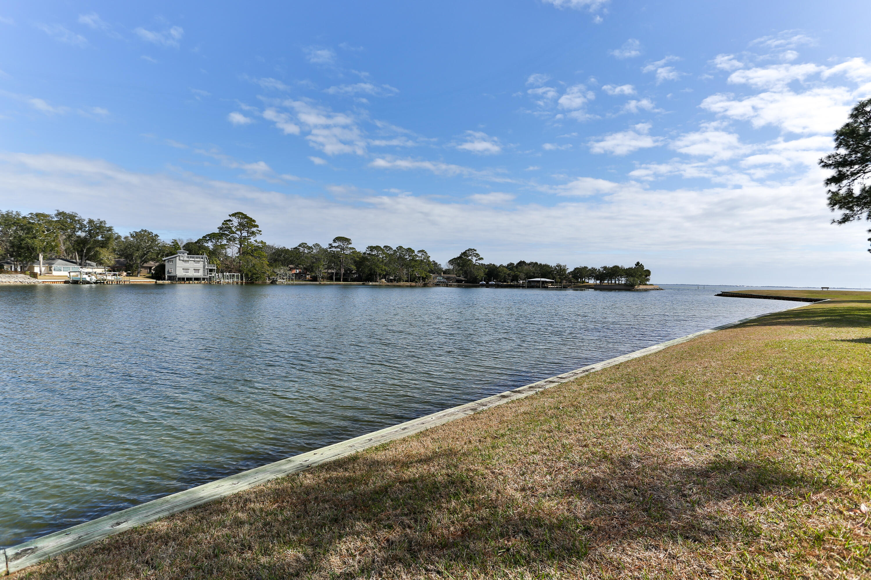 101 Old Ferry Road, Unit 1D Shalimar, FL 32579 - Photo 24 of 34 a view of a lake from a yard