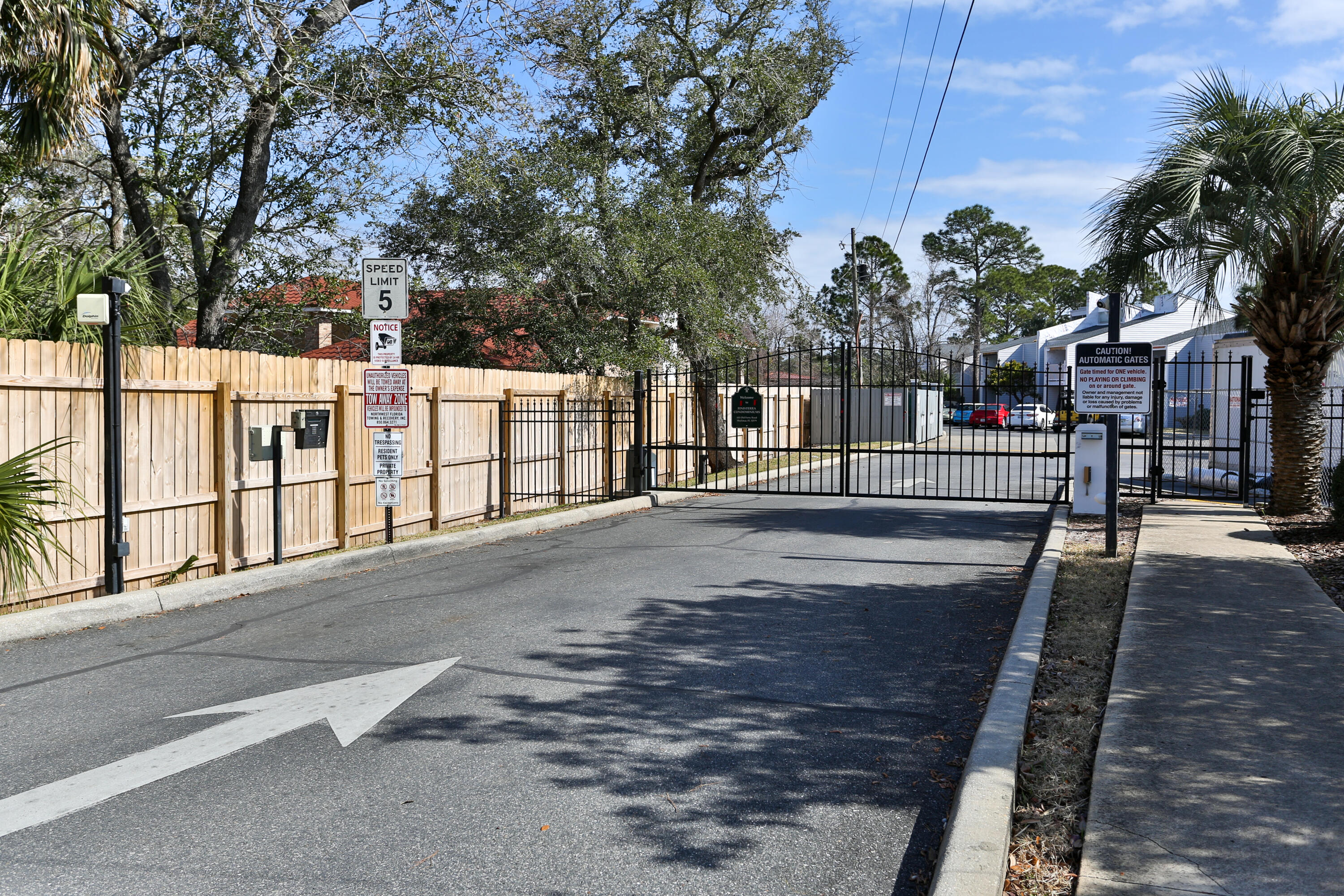 101 Old Ferry Road, Unit 1D Shalimar, FL 32579 - Photo 26 of 34 a view of road with large trees