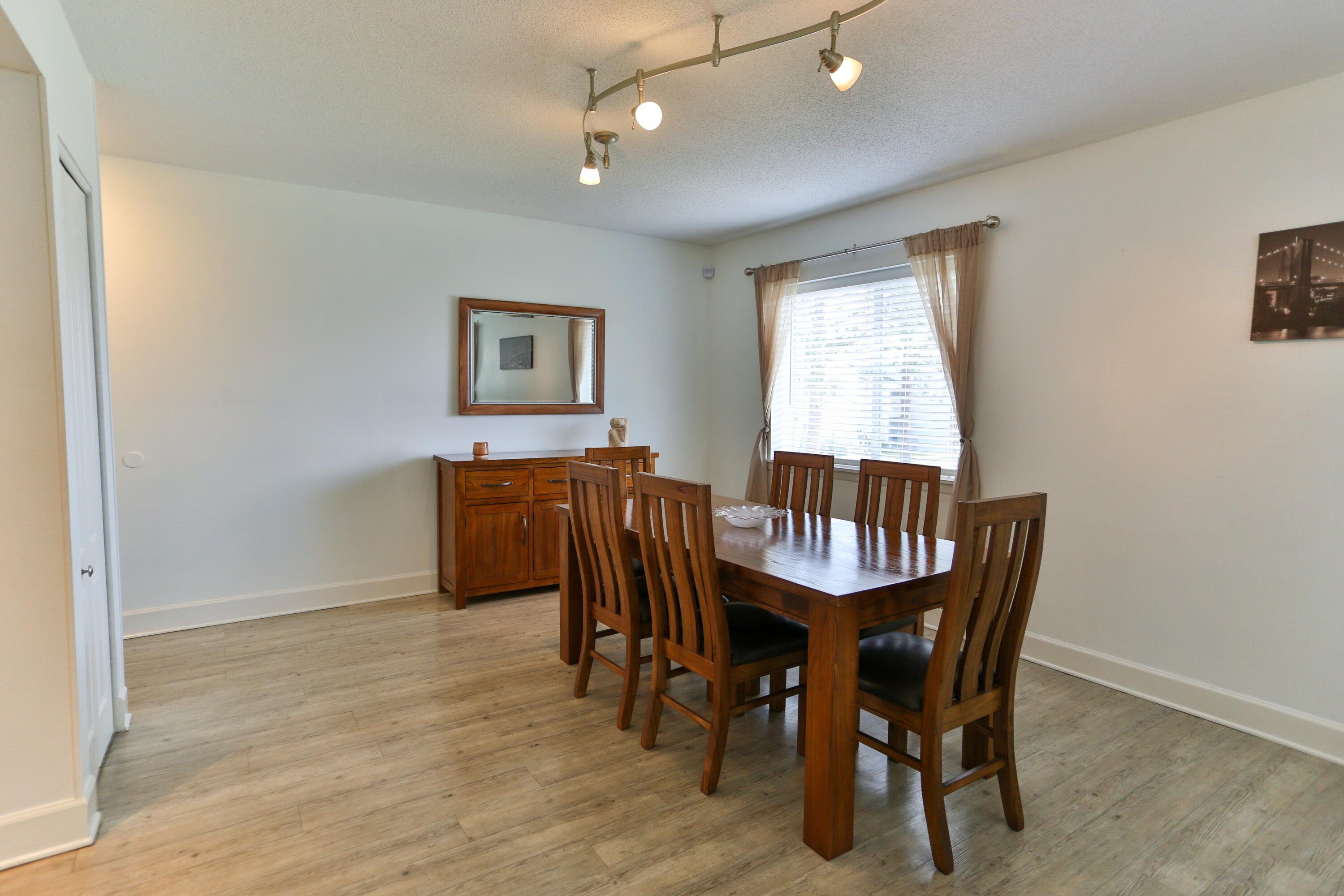 101 Old Ferry Road, Unit 1D Shalimar, FL 32579 - Photo 3 of 34 a view of a dining room with furniture