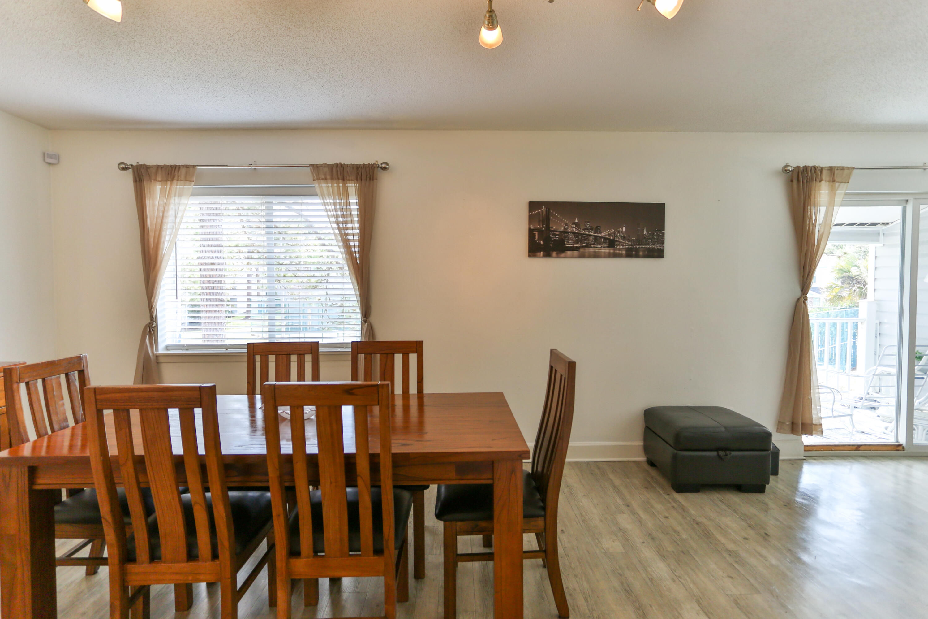 101 Old Ferry Road, Unit 1D Shalimar, FL 32579 - Photo 4 of 34 a view of a dining room with furniture and wooden floor