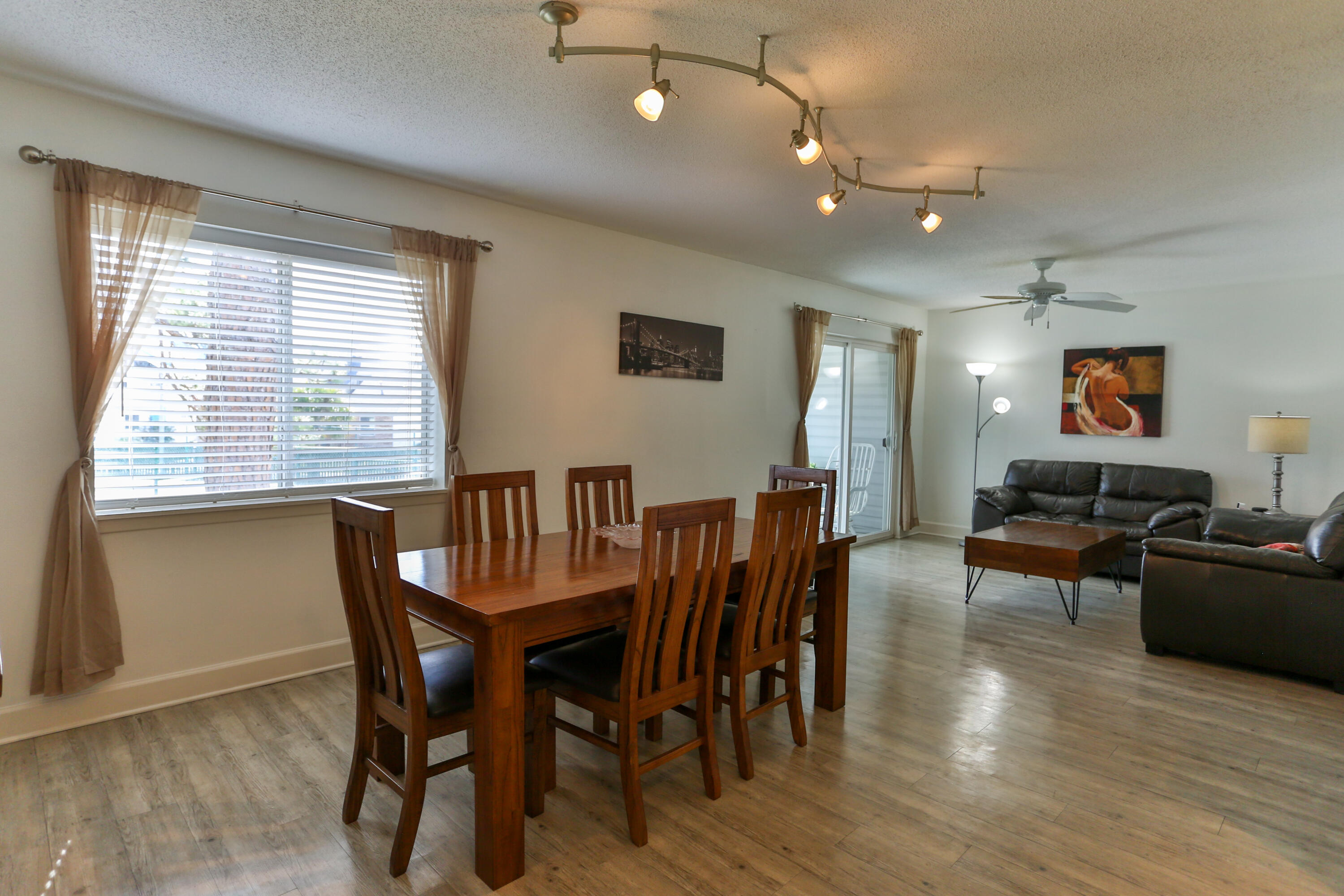 101 Old Ferry Road, Unit 1D Shalimar, FL 32579 - Photo 5 of 34 a view of a dining room with furniture and wooden floor
