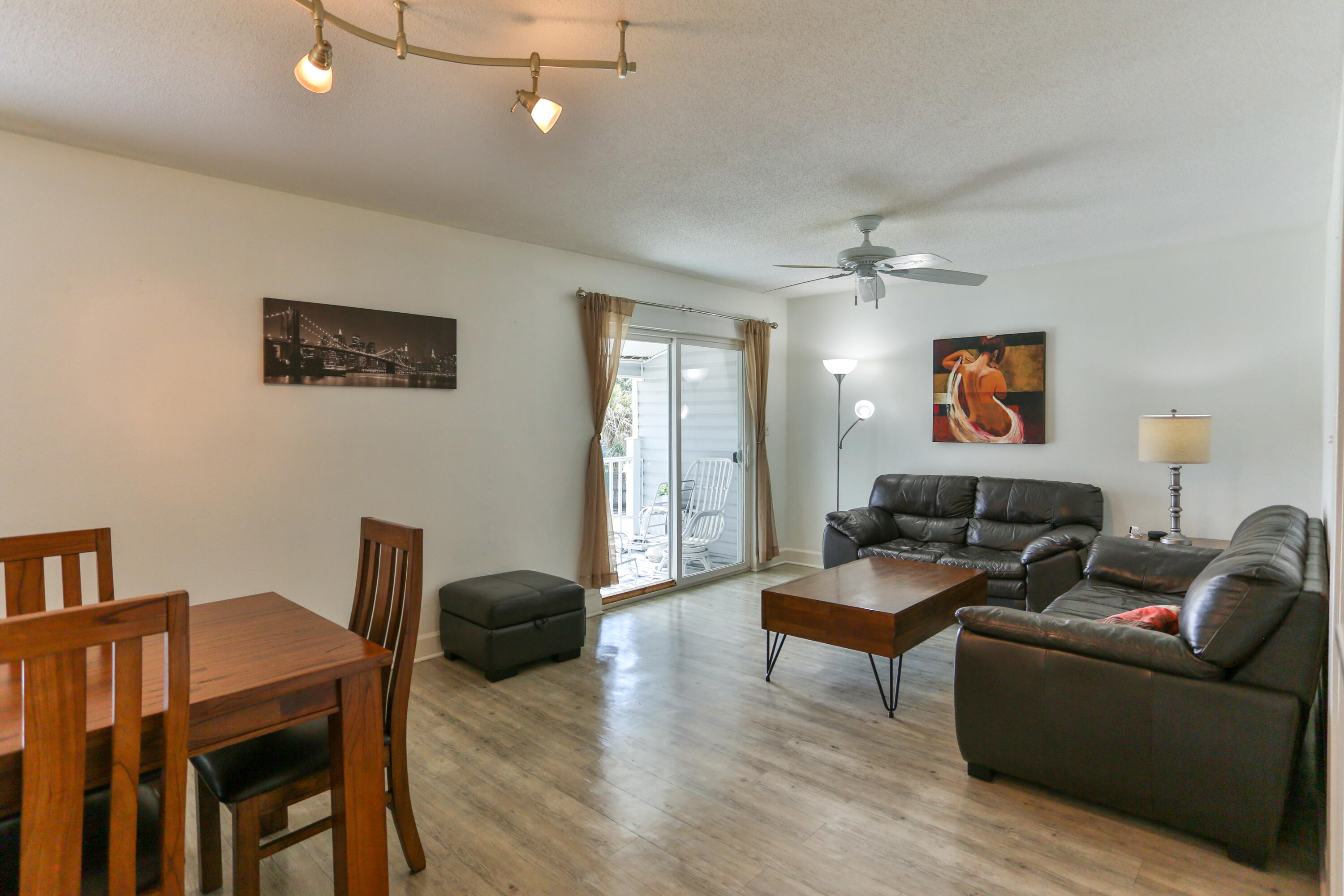 101 Old Ferry Road, Unit 1D Shalimar, FL 32579 - Photo 6 of 34 a living room with furniture and a wooden floor