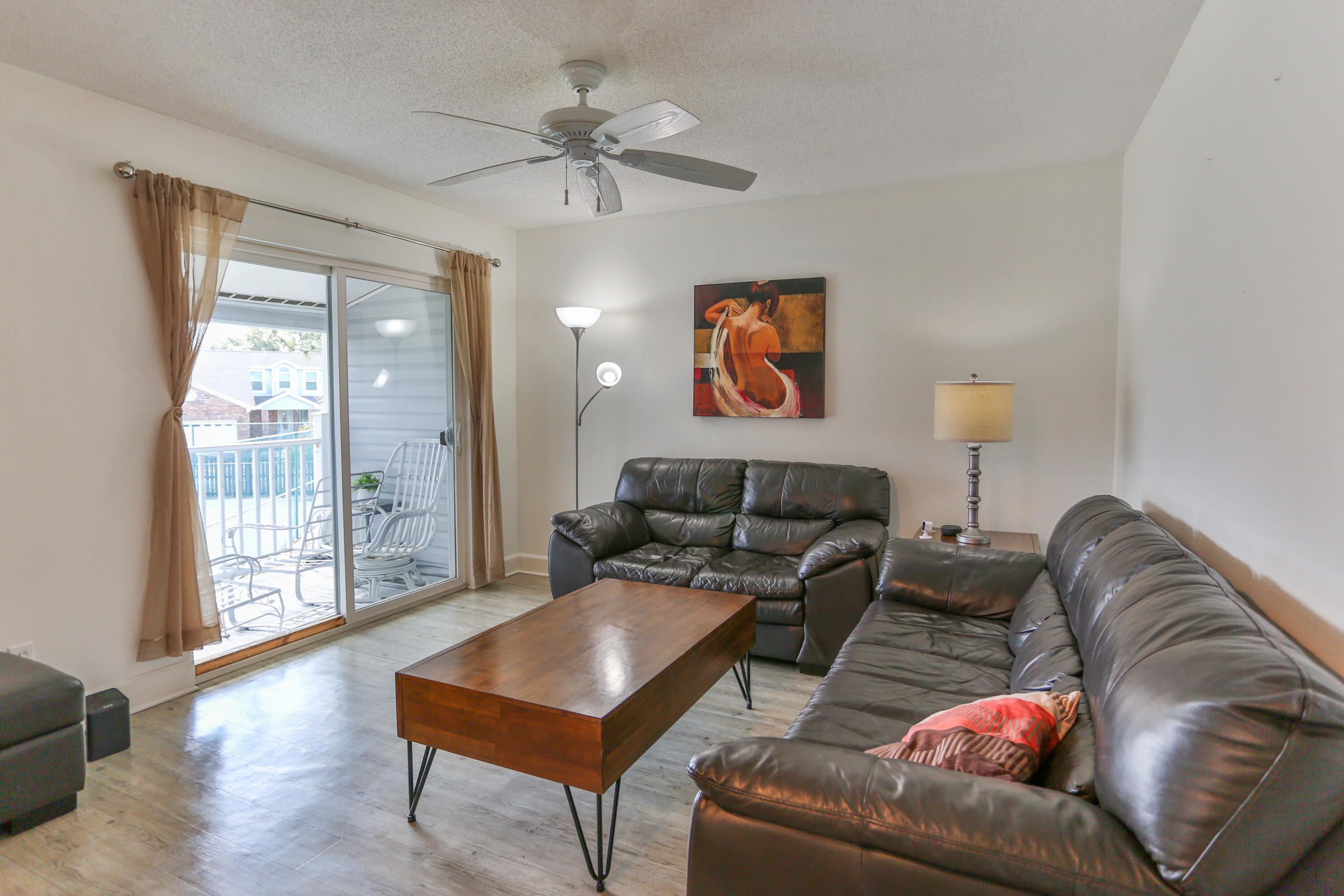 101 Old Ferry Road, Unit 1D Shalimar, FL 32579 - Photo 7 of 34 a living room with furniture and a wooden floor
