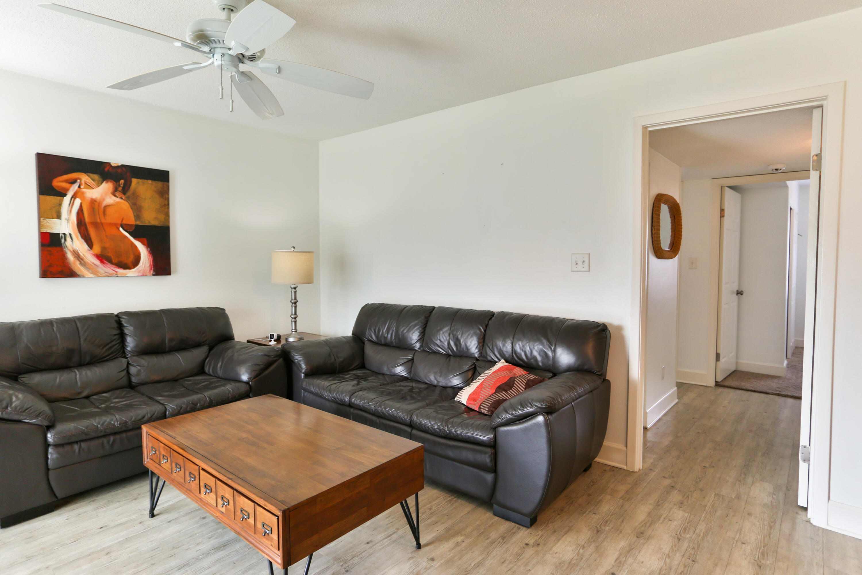 101 Old Ferry Road, Unit 1D Shalimar, FL 32579 - Photo 8 of 34 a living room with furniture and a rug