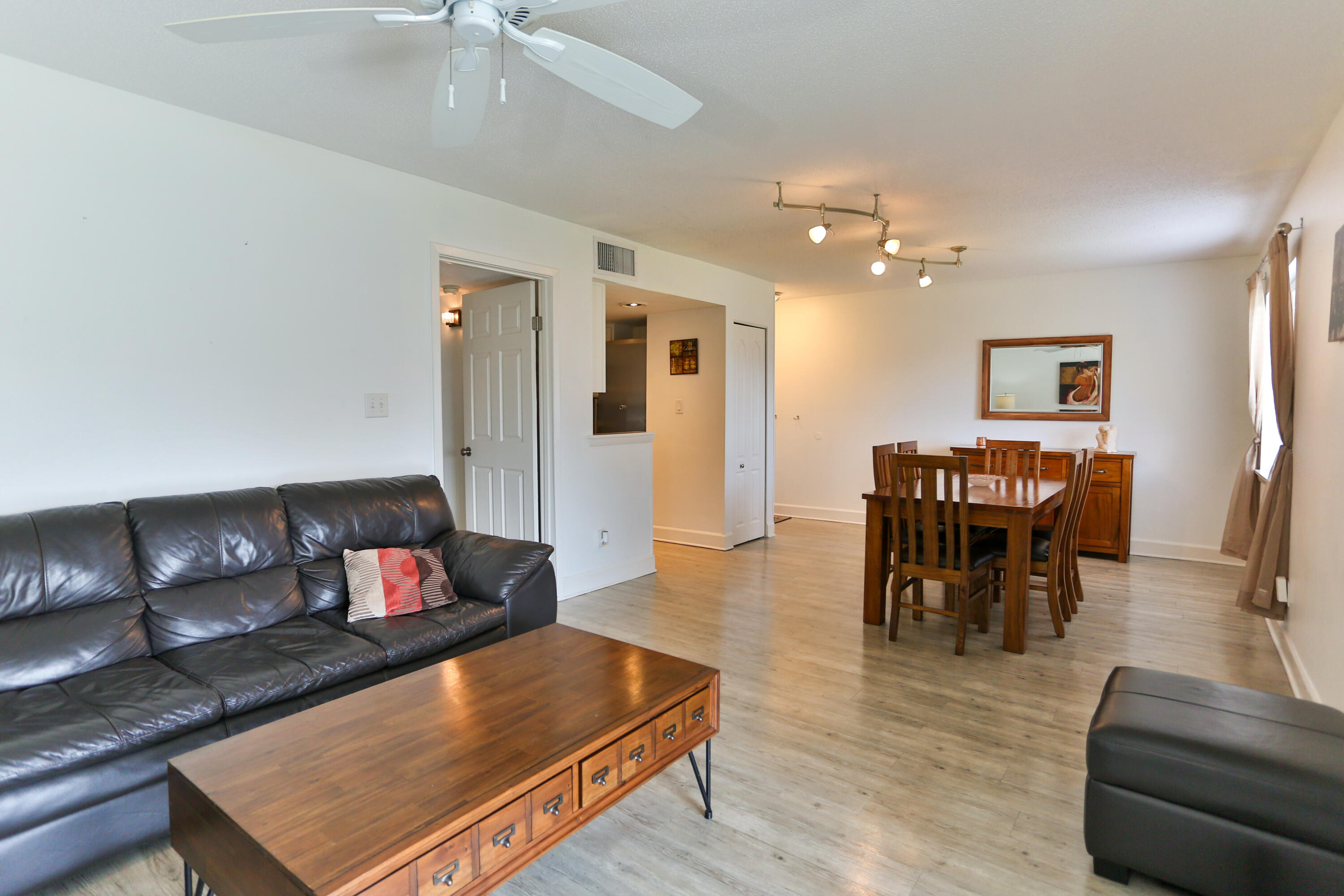 101 Old Ferry Road, Unit 1D Shalimar, FL 32579 - Photo 9 of 34 a living room with furniture and wooden floor